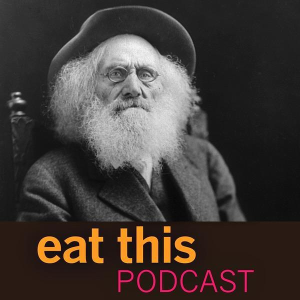 Auto-generated description: A man with a long beard and a hat is depicted in black and white, with the text eat this PODCAST in the foreground.