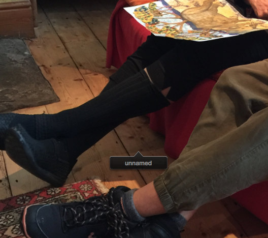 Screenshot from Apple's Aperture, which has labelled knots in a floorboard as a face to be named.