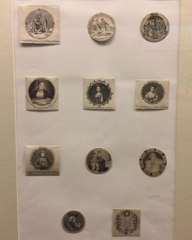 Auto-generated description: A collection of nine vintage engravings isplayed on a light background, each featuring different historical figures or designs.
